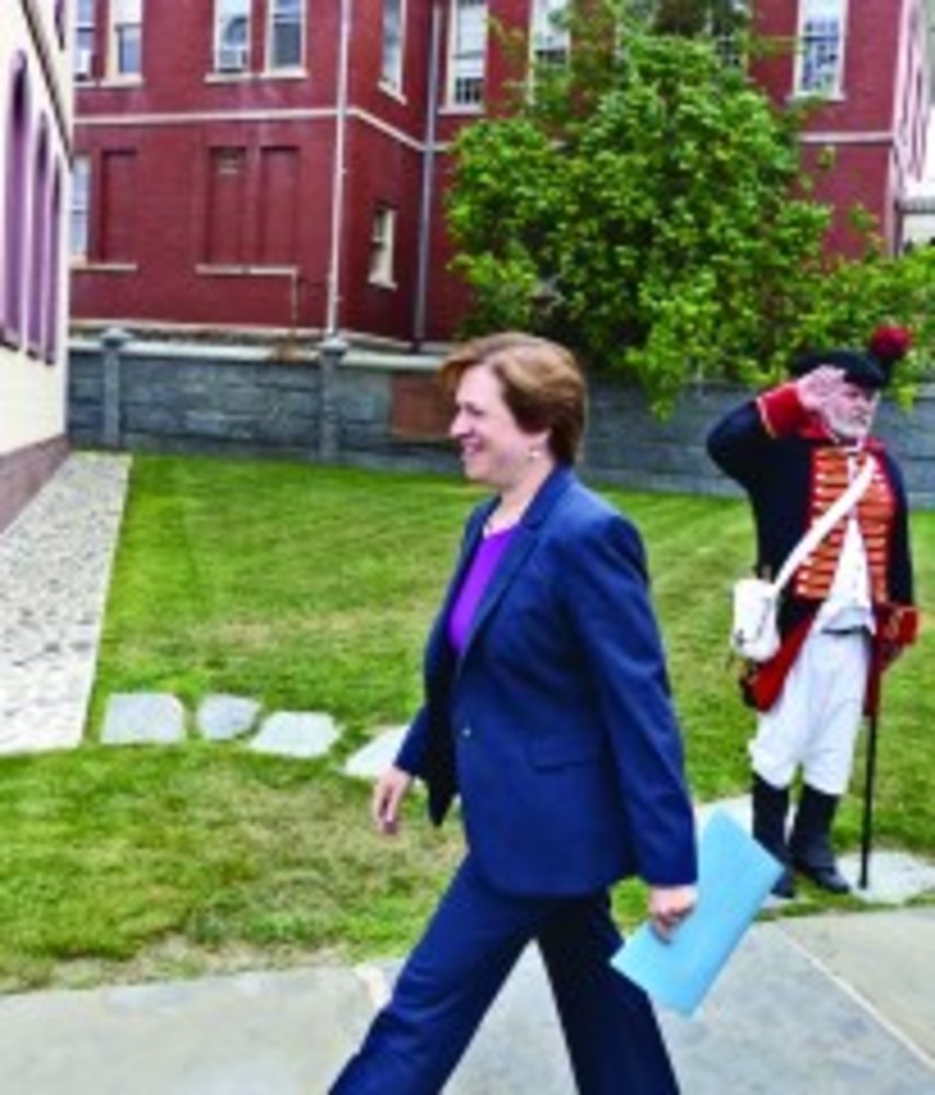 Elena Kagen, associate justice of the U.S. Supreme Court, enters Touro Synagogue on Sunday, Aug. 18; a member of the Newport Artillery is at right. /SAM  SHAMOON